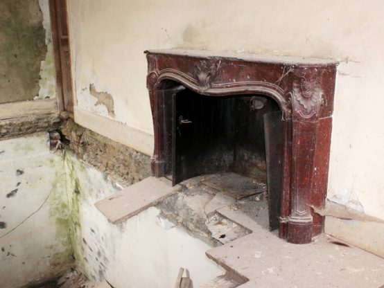 An eighteenth-century marble mantel, hanging by a thread