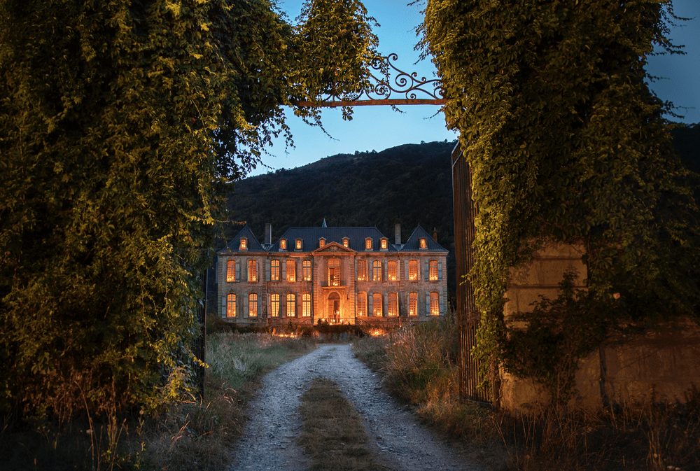 The château lit at dusk