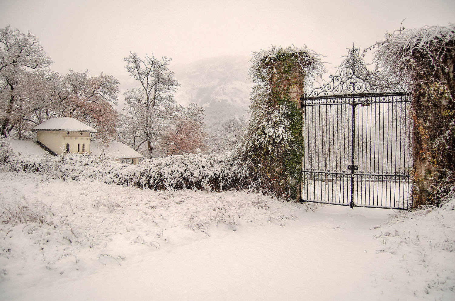 The gates and the pigeonnier in snow