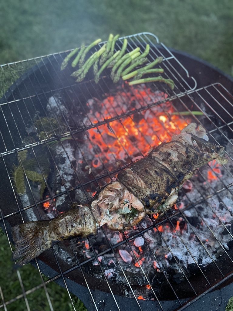 On the grill, over the fire