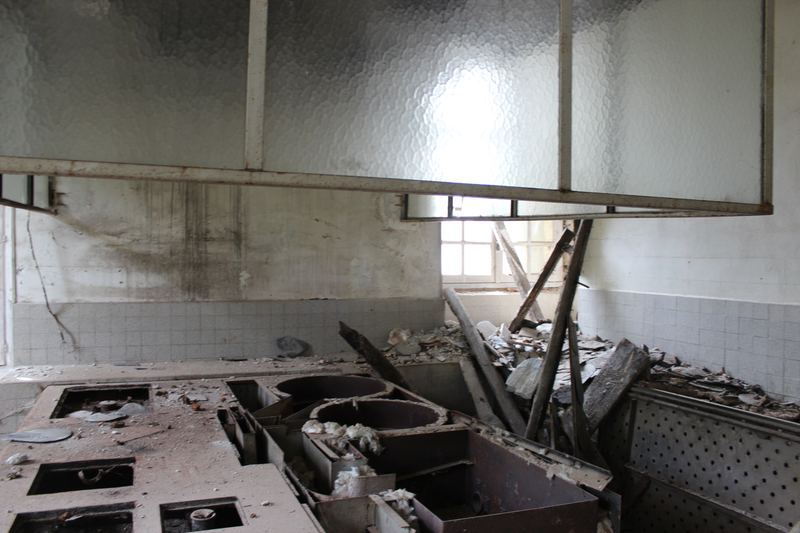 The holiday-camp kitchen, as it was left