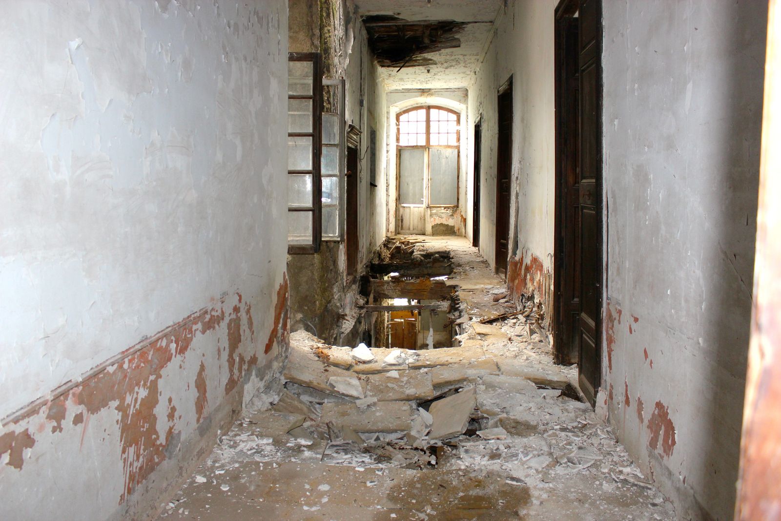 A long corridor, the floor giving way