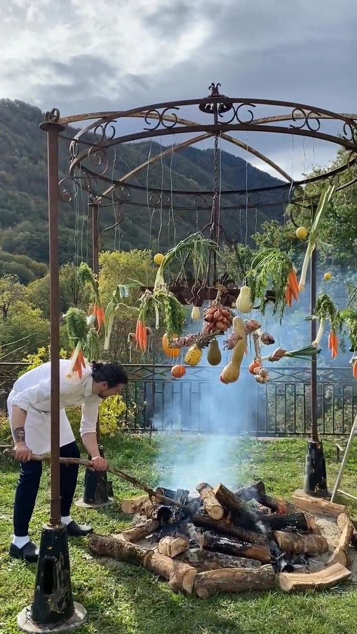 Cooking outdoors, over an open fire