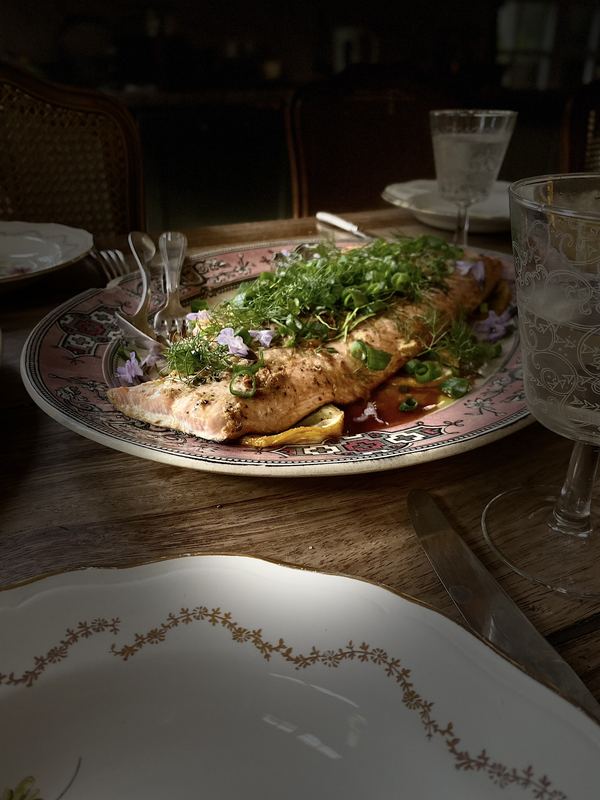 Fish with herbs on a floral plate