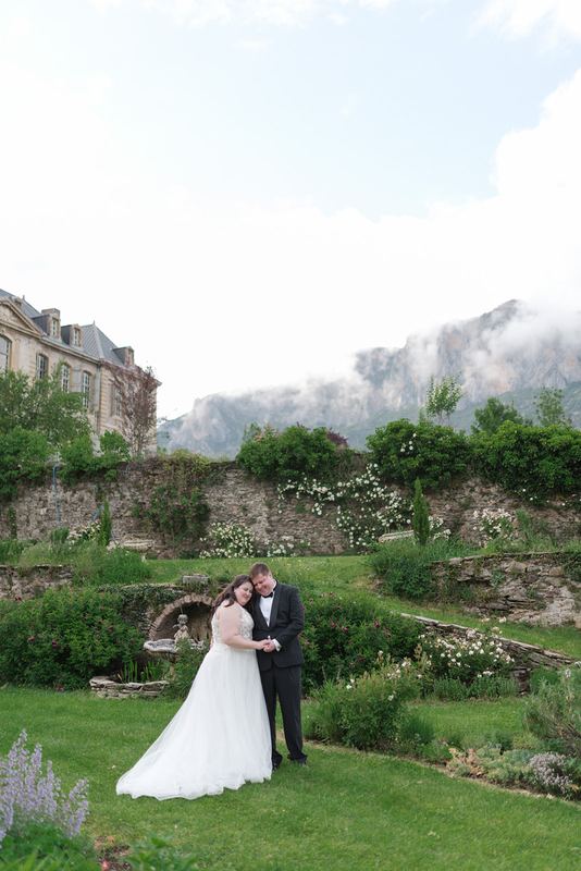 In the formal garden, mist on the mountain
