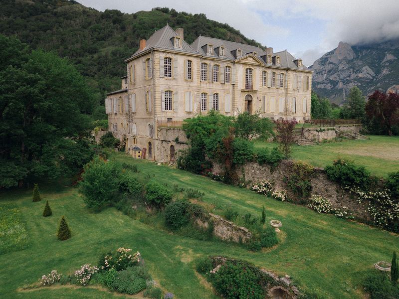 The château from the air, the mountains behind