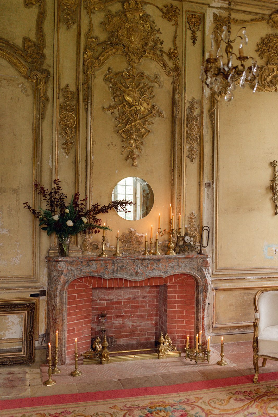 The gilded salon’s fireplace
