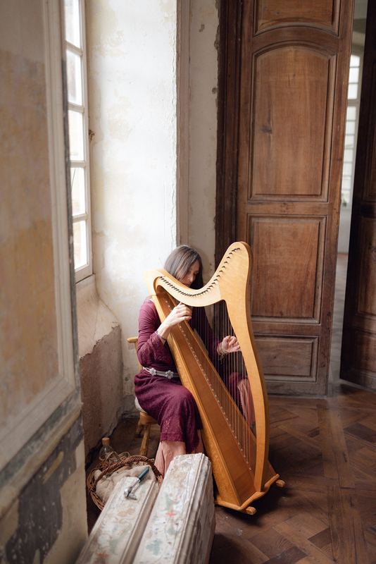 A harp by the tall window