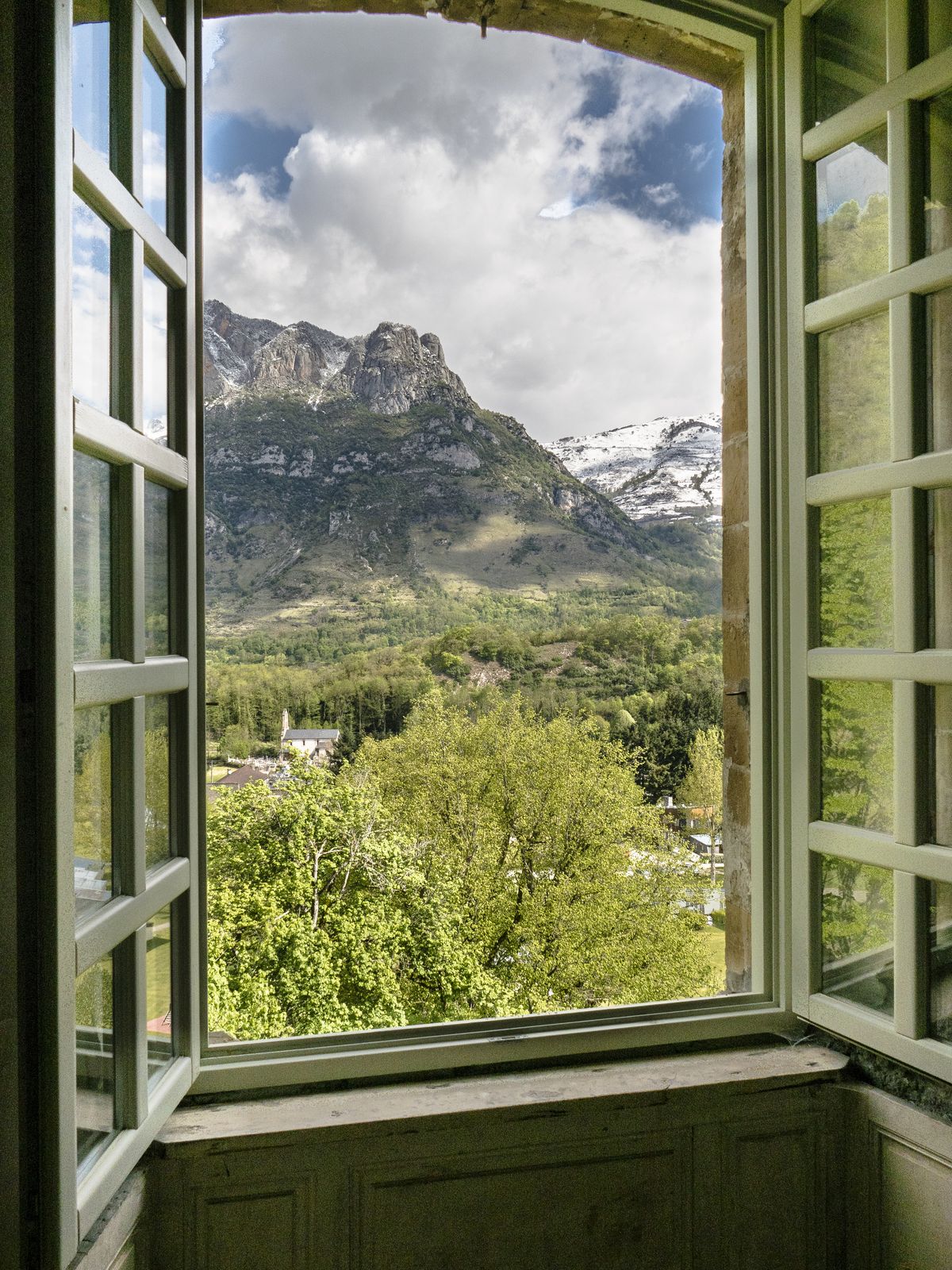 Clouds over the peaks, the windows thrown open