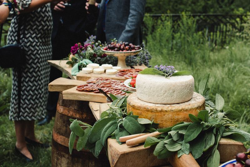 A table of cheeses and herbs in the grounds