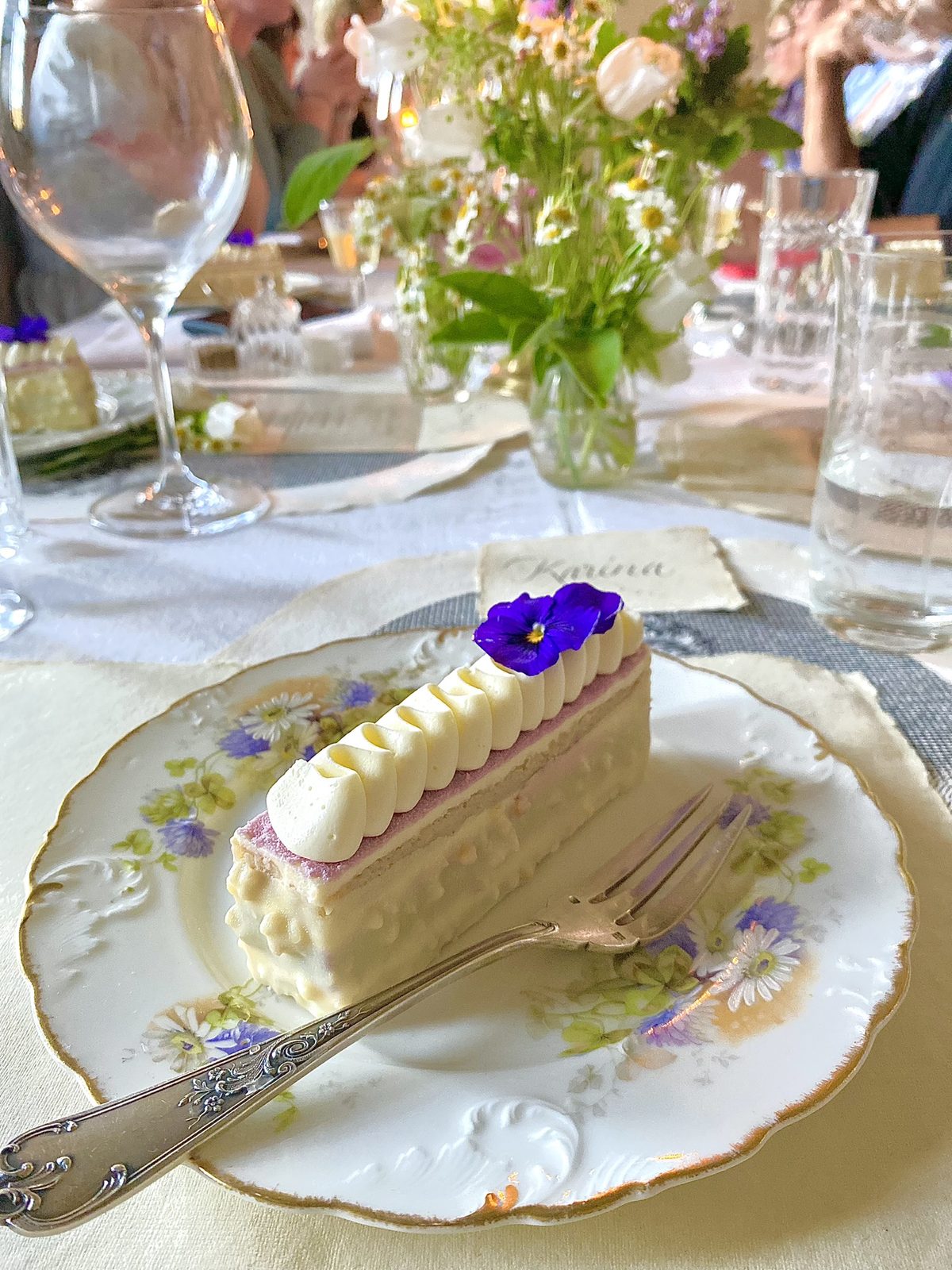 A slice of cake with violas