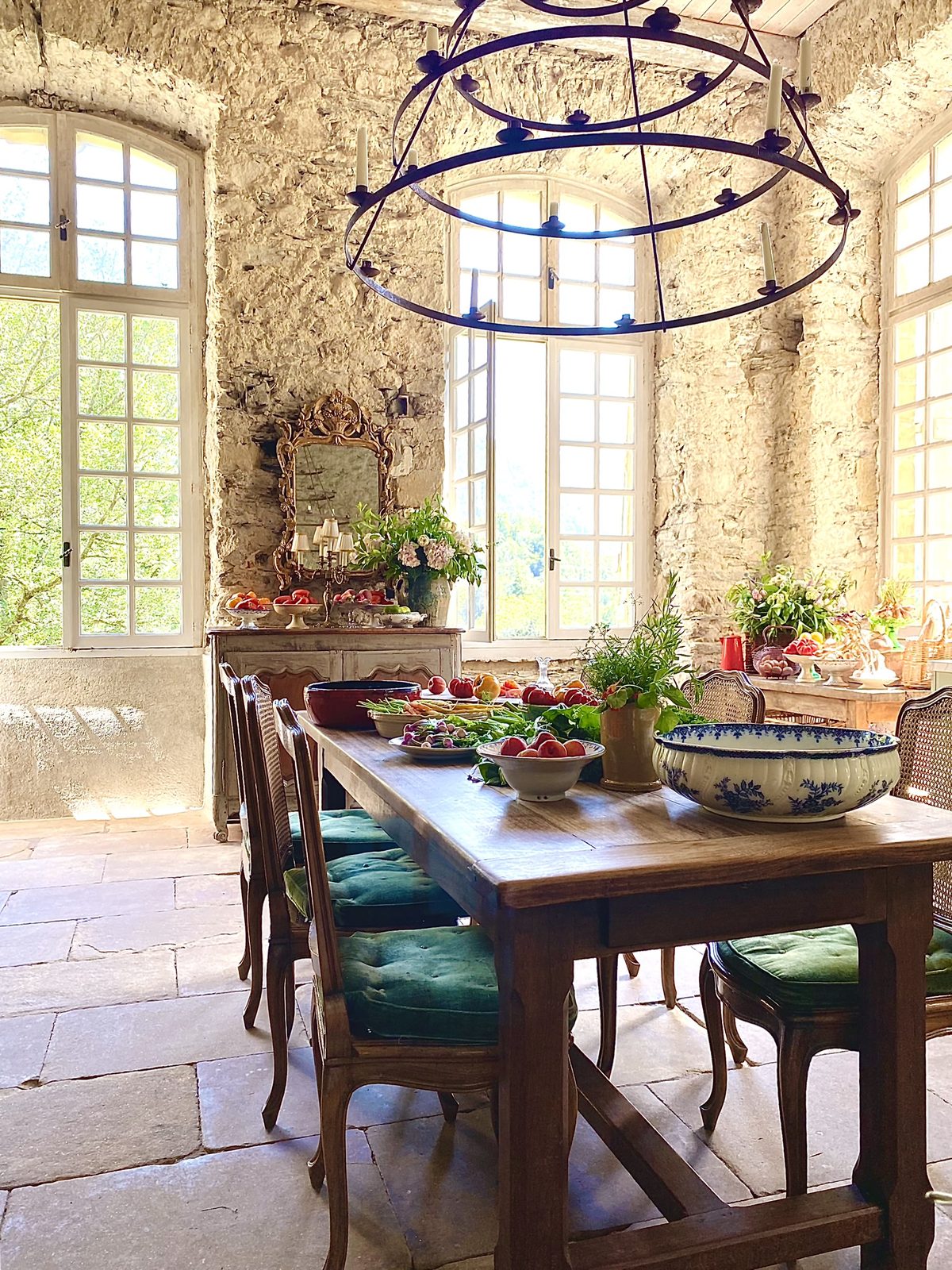 A table under an iron chandelier