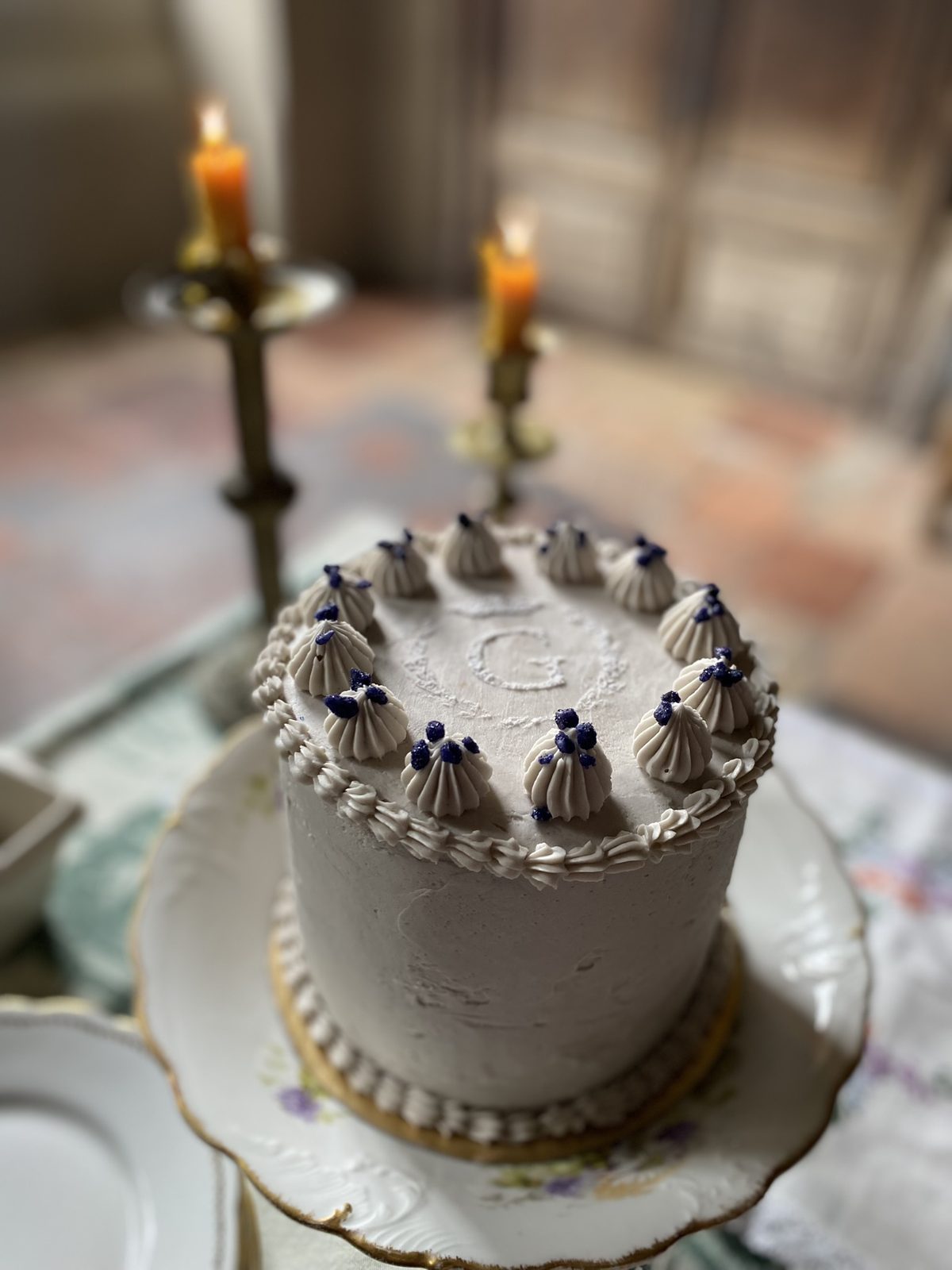 An iced cake by candlelight