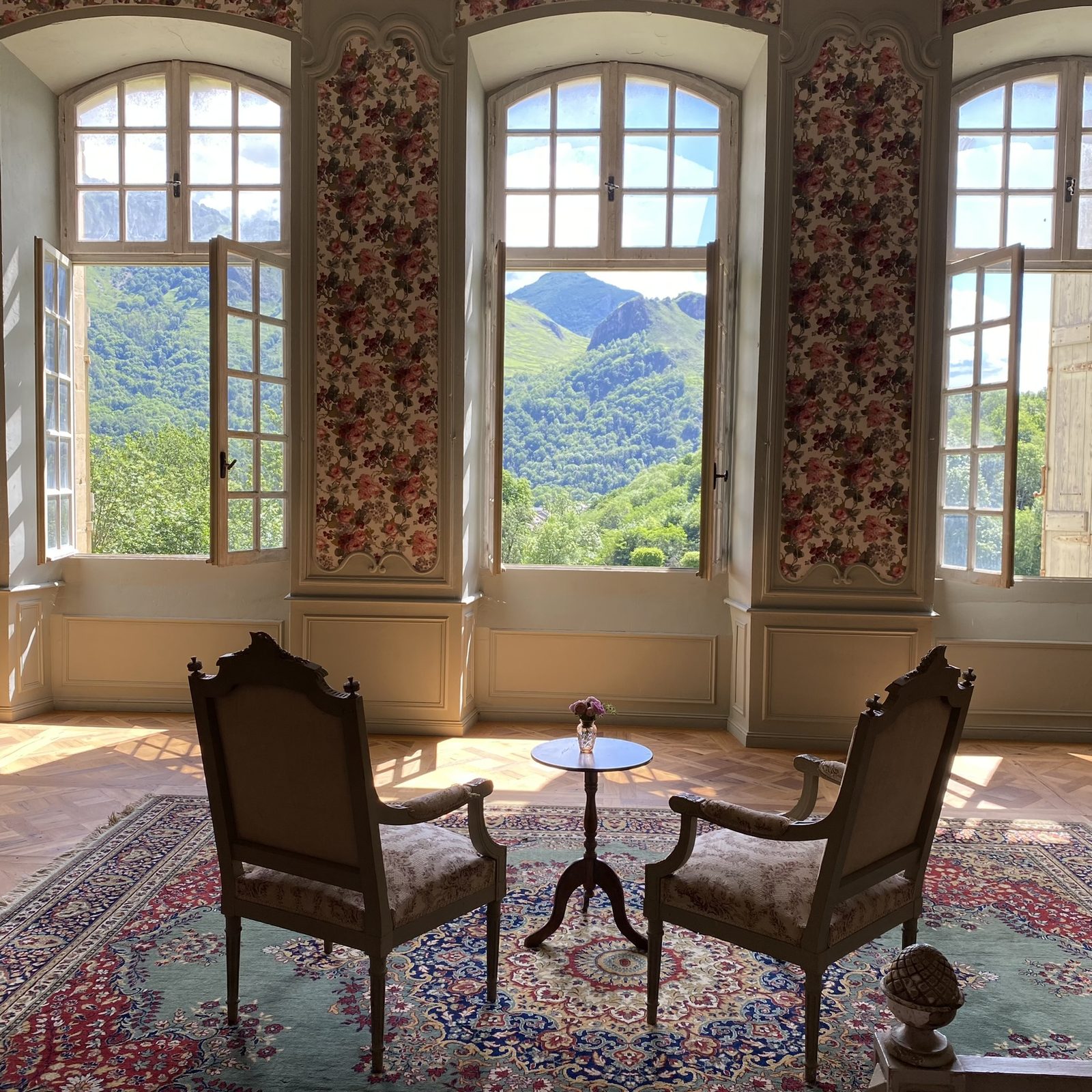 A salon, the mountains through its windows
