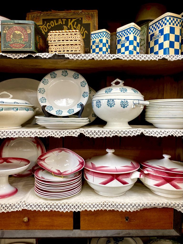 Shelves of china, pink and white