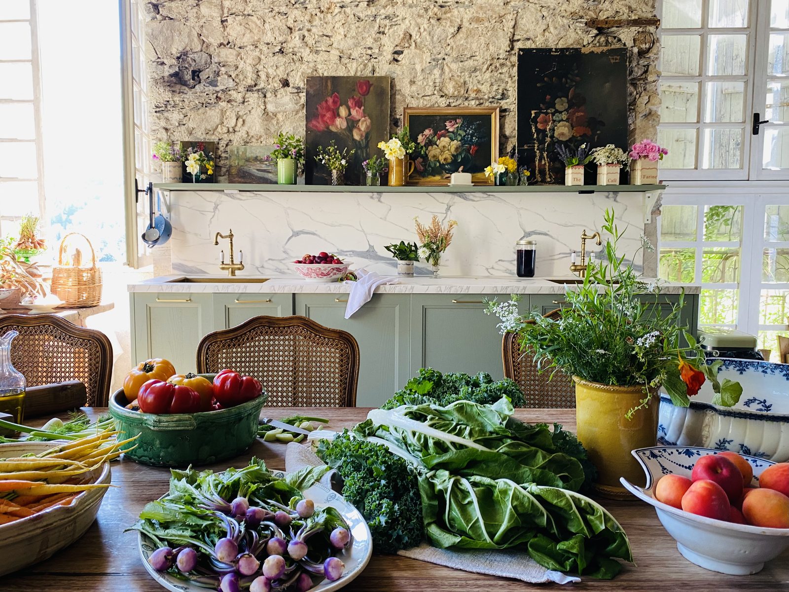 The kitchen, its table laid with fresh produce